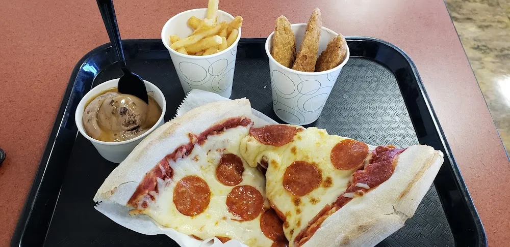 Pepperoni Pizza French Fries Chicken Fingers and Chocolate Brownie Ice with Caramel